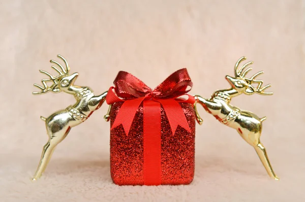 Red Christmas gift box and gold horse