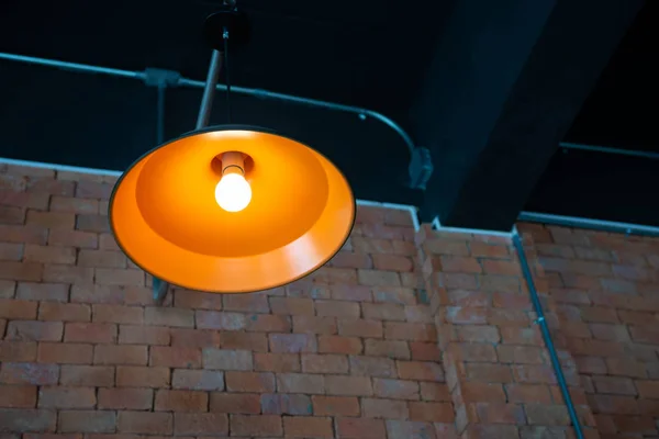 Orange ceiling lamp with LED lighting bulb