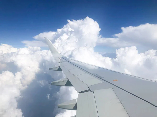 Aircraft wing fly through the clouds
