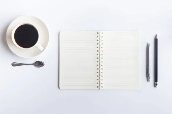 White desk office with laptop, smartphone and other work supplies with cup of coffee. Top view with copy space for input the text. Designer workspace on desk table essential elements on flat lay.