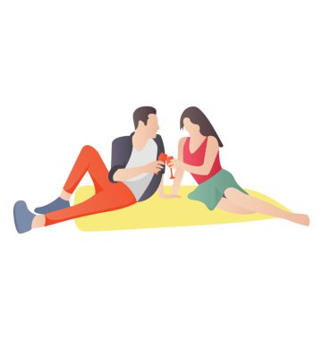 Açık bir piknik yerinde oturan bir çift 