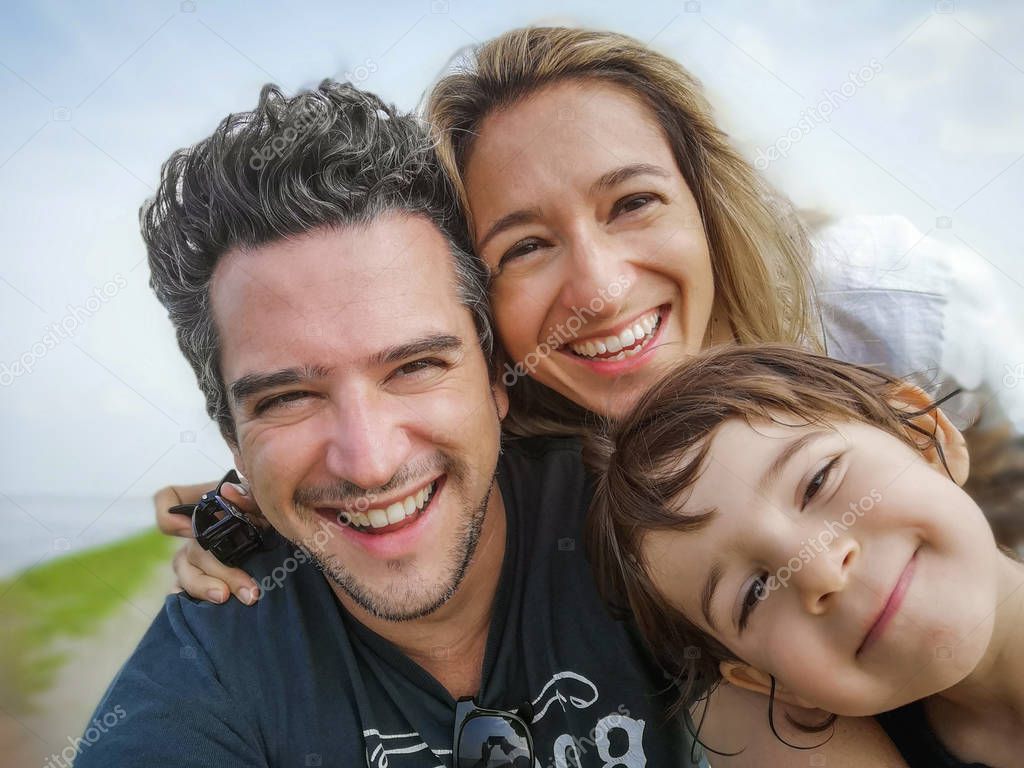 caucasian family portrait selfie only son thirty year old parents only son child