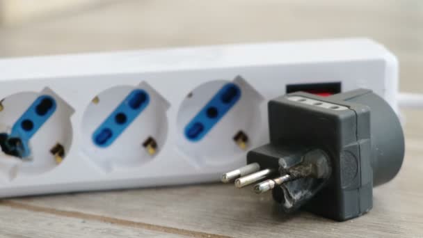 A burnt power strip melted plastic for electrocution danger — Stock Video