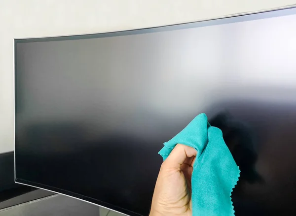 Cleaning pc monitor hand hold rag — Stock Photo, Image