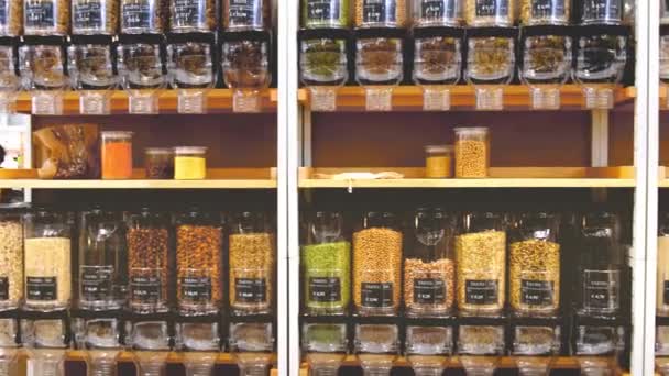 Bulk food store dispenser bins shelves sustainable zero waste eco friendly shop market — Stock Video