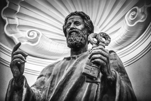 Saint Peter holding the Keys of heaven - the apostle keeper of the gates of eden in a statue inside the vatican museum in Castel Gandolfo - Rome - Italy Stock Image