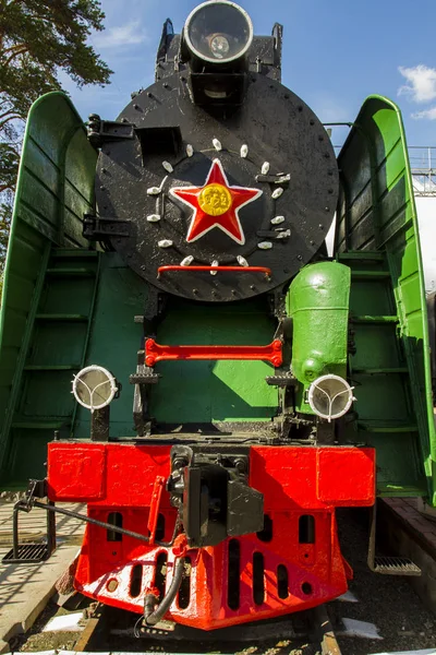 Exterior of old Russian locomotives. Locomotives with a star. Museum of steam locomotives in the open air. Industrial Design.