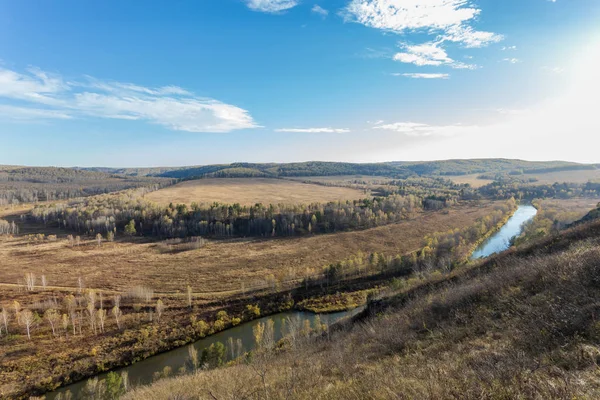 The bed of the Siberian river Berd. The change of seasons in Russia. The last days of golden autumn. Autumn landscape. View from above.