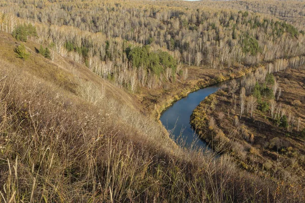 The bed of the Siberian river Berd. The change of seasons in Russia. The last days of golden autumn. Autumn landscape. View from above.