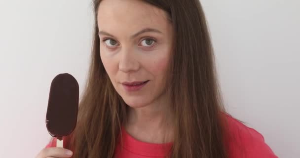 Girl eating ice cream stick — Stock Video