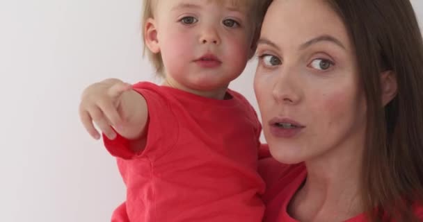 Woman holding baby her arms — Stock Video