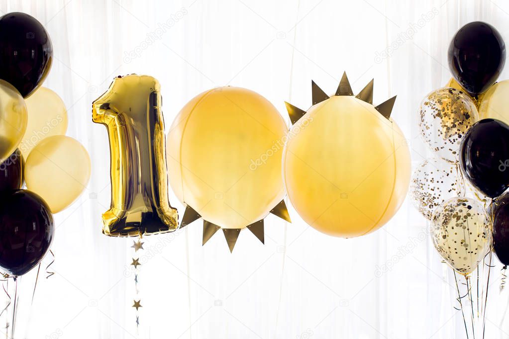 Yellow black helium balloon number one hundred 100