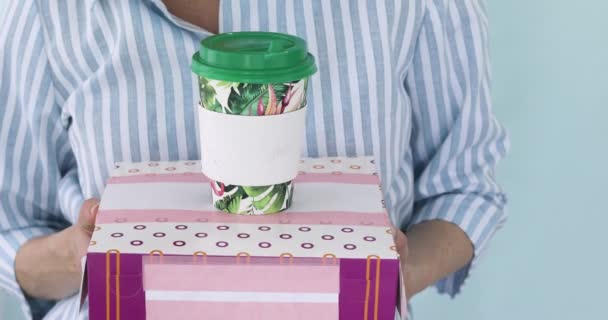 Woman is holding a box of donuts and coffee — Stock Video