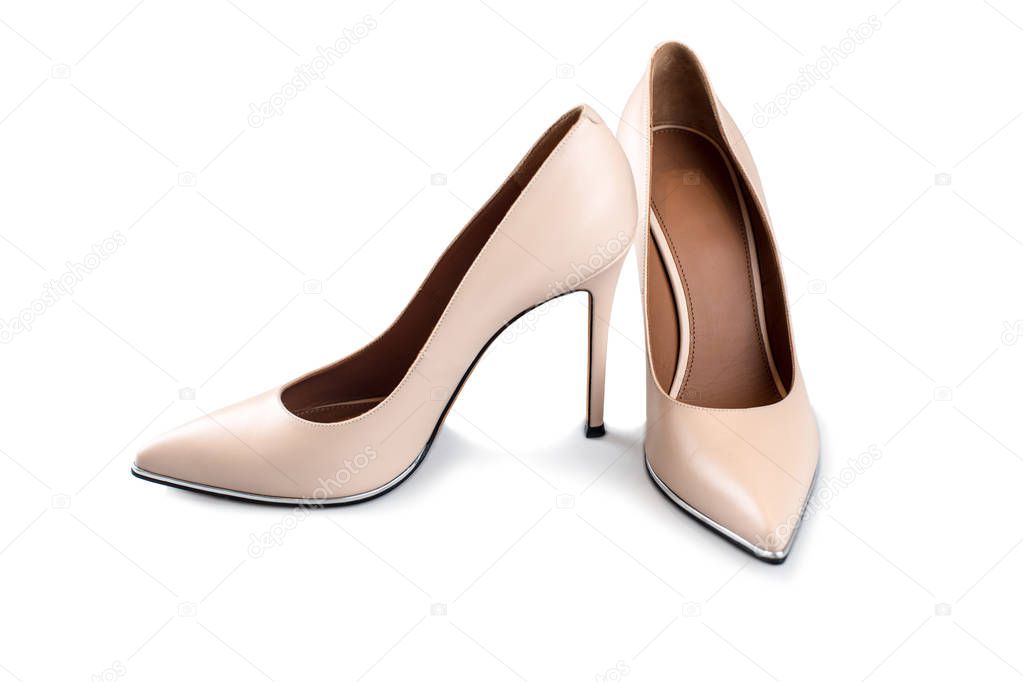 Beige high heel shoes isolated on white