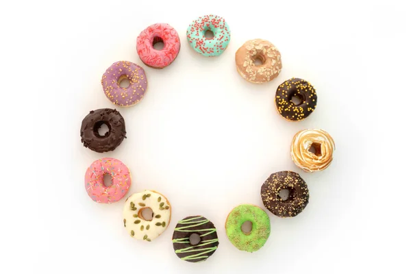 Doce donuts arranjados — Fotografia de Stock