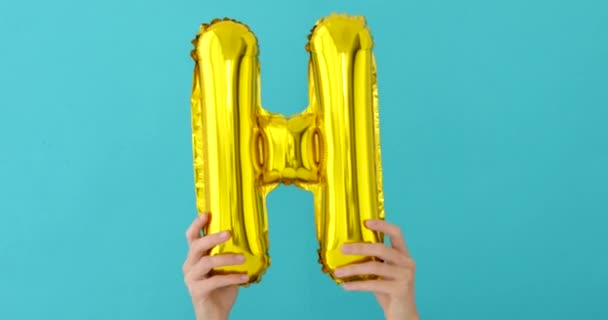 Carta folha de ouro H celebração balão — Vídeo de Stock