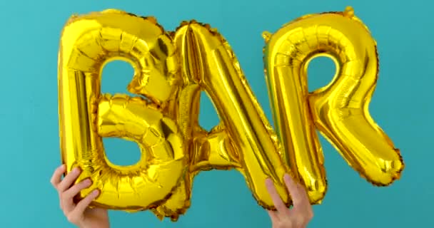 Golden BAR word made of inflatable balloons — Stock Video