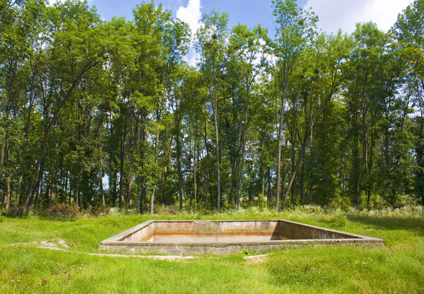 Vinnitsa, Ukraine - August 4, 2018: The surviving fire-fighting pool in Werwolf (Stavka of Adolf Hitler). Nowadays Historical and memorial complex of victims of Nazism" near Vinnitsa