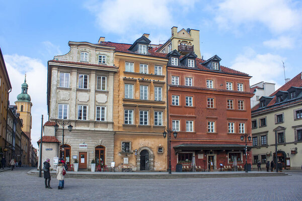 Warsaw, Poland - February 24, 2018: Colorful houses in Castle Square in the Old Town of Warsaw