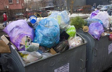 Kyiv, Ukraine - January 6, 2019:  Garbage containers are overflowing