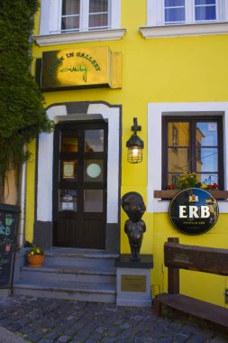 BRATISLAVA, SLOVAKIA - April 1, 2019: The entrance of a pub in Old Town in Bratislava clipart