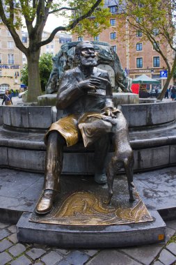 Bronze monument to the burgomaster of Brussels Charles Buls and his dog on the Agora Grasmarkt square in Brussels