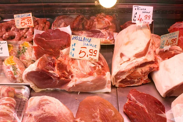 Butcher sells meat at famous local market Ballaro in Palermo, Italy