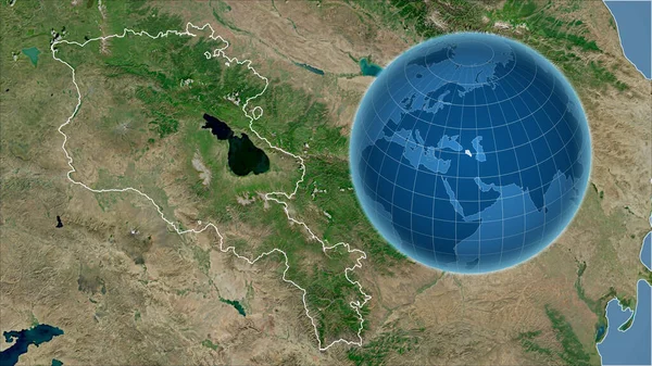 Armenia. Globe with the shape of the country against zoomed map with its outline. satellite imagery