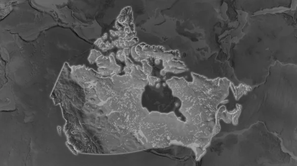 加拿大的面积扩大了 在其周围环境的黑暗背景下闪闪发光 灰度隆起地图 — 图库照片