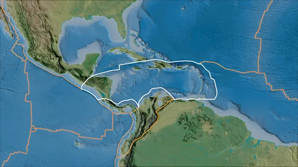 Outlined Caribbean tectonic plate and borders of adjacent plates on the topographic map in the van der Grinten I projection (oblique transformation)