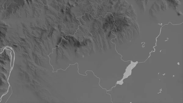 Heves, county of Hungary. Grayscaled map with lakes and rivers. Shape outlined against its country area. 3D rendering