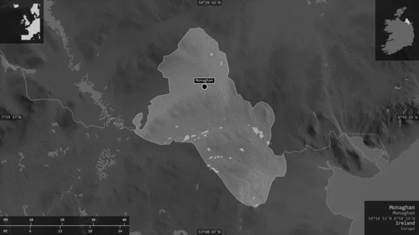 Monaghan, county of Ireland. Grayscaled map with lakes and rivers. Shape presented against its country area with informative overlays. 3D rendering