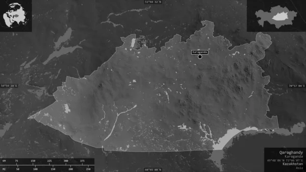 Qaraghandy, region of Kazakhstan. Grayscaled map with lakes and rivers. Shape presented against its country area with informative overlays. 3D rendering