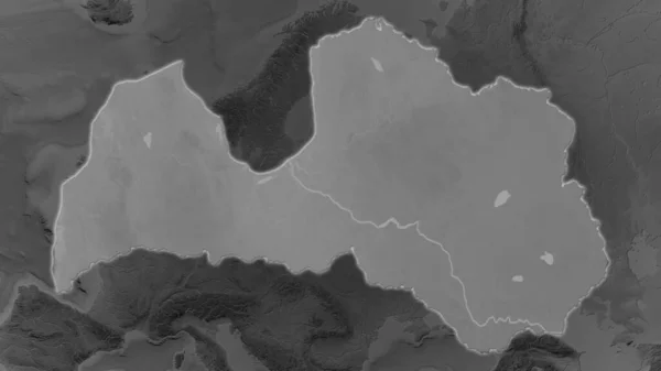 Latvian Alue Laajentunut Hehkunut Ympäristönsä Pimeällä Taustalla Harmaasävyinen Kohokuviokartta — kuvapankkivalokuva