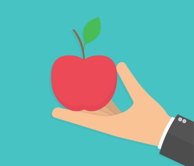 Kırmızı elmayı tutan el.