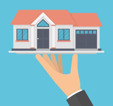 Bir tabakta bir ev modeli tutarak El