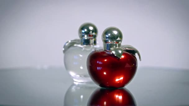 Modern Glass Perfume Bottles Rotate White Background — Stock Video