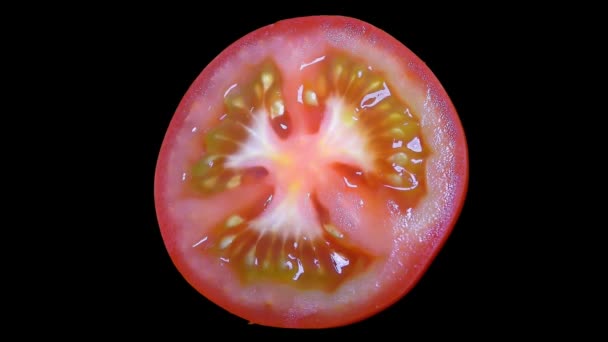 Cut Tomato Isolated Black Background Вращение — стоковое видео