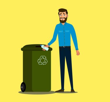 The concept of caring for the environment and sorting garbage. Young man throws a plastic bottle into the trash can. .