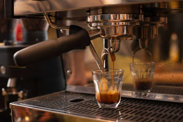 espresso machine pouring espresso, barista on work, cafe scene, making espresso