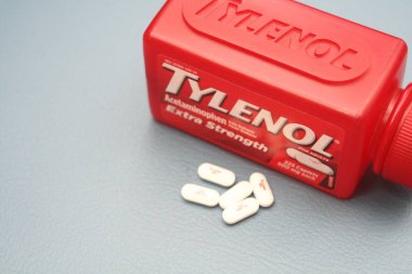 wa usa, 09 23 2025: Tylenol Extra Strength 500mg caplets for adults in a red bottle, pain relief and fever reducer.