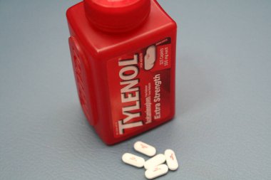 wa usa, 09 23 2025: Tylenol Extra Strength 500mg caplets for adults in a red bottle, pain relief and fever reducer.