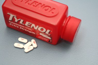 wa usa, 09 23 2025: Tylenol Extra Strength 500mg caplets for adults in a red bottle, pain relief and fever reducer.