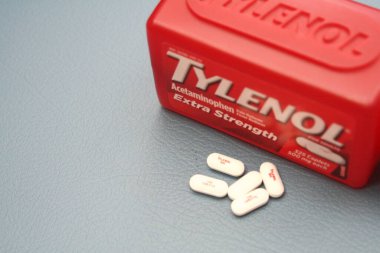 wa usa, 09 23 2025: Tylenol Extra Strength 500mg caplets for adults in a red bottle, pain relief and fever reducer.