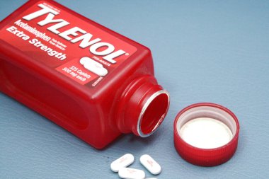wa usa, 09 23 2025: Tylenol Extra Strength 500mg caplets for adults in a red bottle, pain relief and fever reducer.