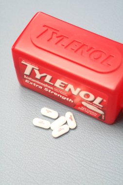 wa usa, 09 23 2025: Tylenol Extra Strength 500mg caplets for adults in a red bottle, pain relief and fever reducer.