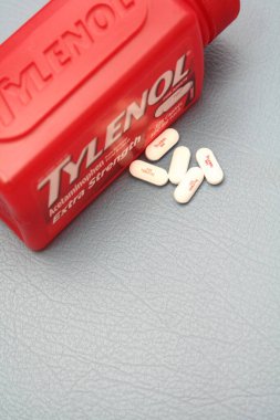 wa usa, 09 23 2025: Tylenol Extra Strength 500mg caplets for adults in a red bottle, pain relief and fever reducer.