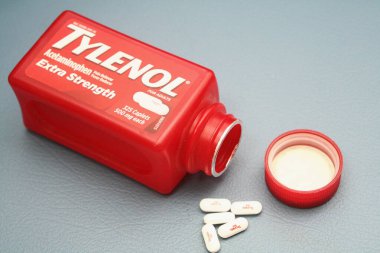 wa usa, 09 23 2025: Tylenol Extra Strength 500mg caplets for adults in a red bottle, pain relief and fever reducer.