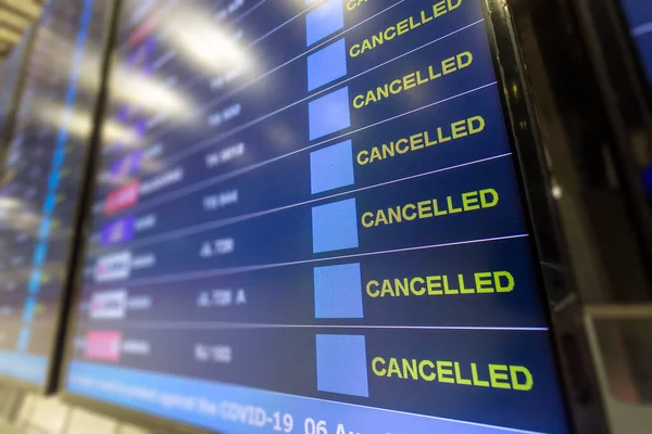 stock image Cancelled all flight on flight information board at airport effect from COVID-19 pandemic situation and lockdown policy