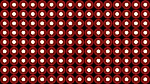Lampor blinkar vägg runda lökar mönster vertikal rotation scenen röd bakgrund vj loop — Stockvideo